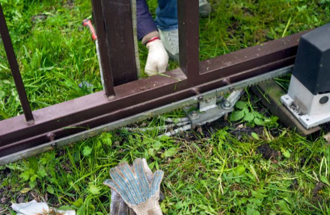 On-site automatic gate repair in Adelaide, servicing a sliding gate’s track and hardware to improve reliability by Auto Gate Guys Adelaide.